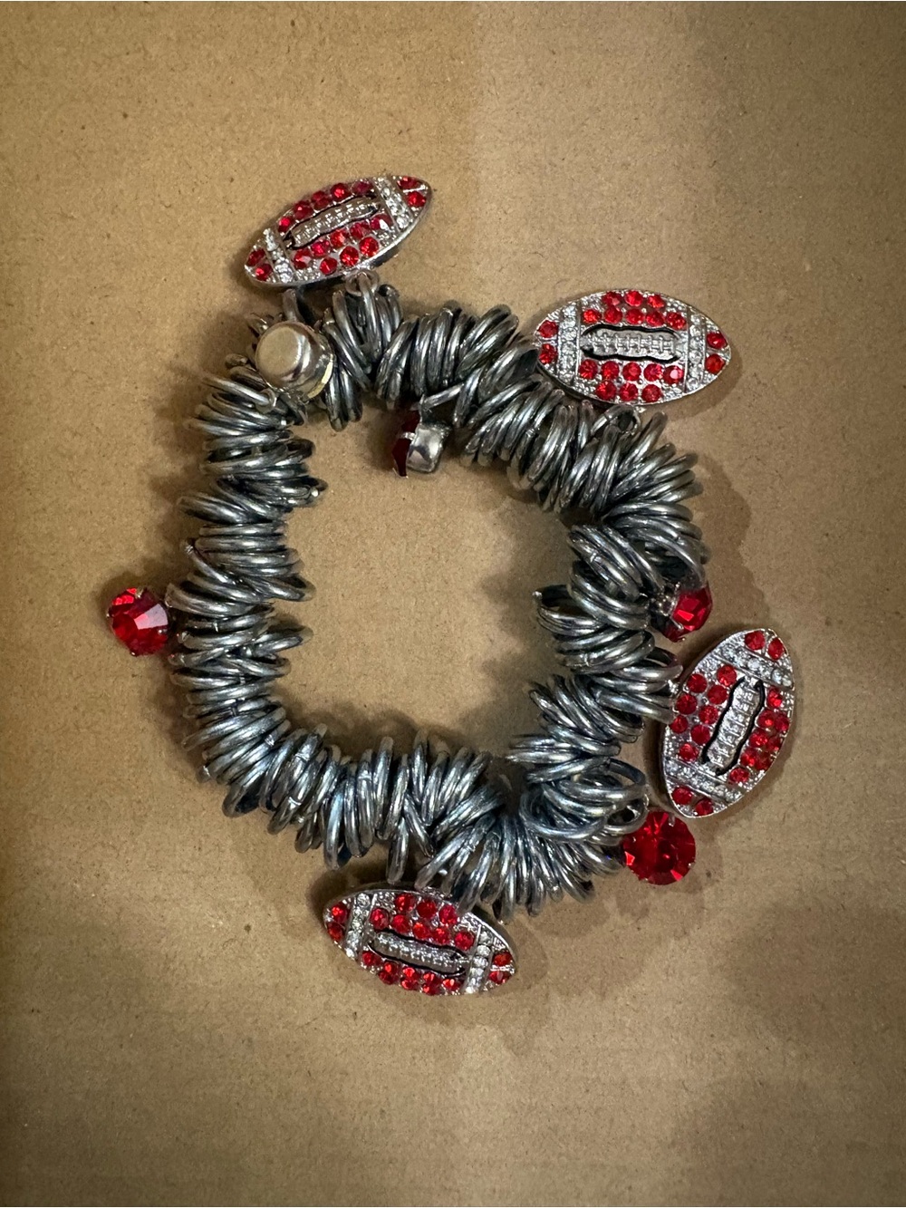 Silver-Tone Coil Bracelet with Red Crystal Football Charms